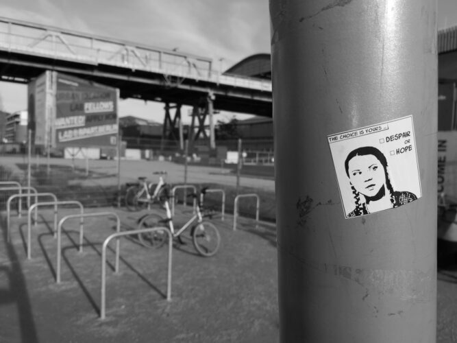 fridays-for-future-Language-study-protests-france-students greta thunberg sticker on a wall in black and white